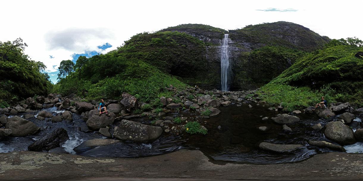 Panoramoric photo of Janel Macy and Jon Jasper in front of Hanakapi'ai Falls.